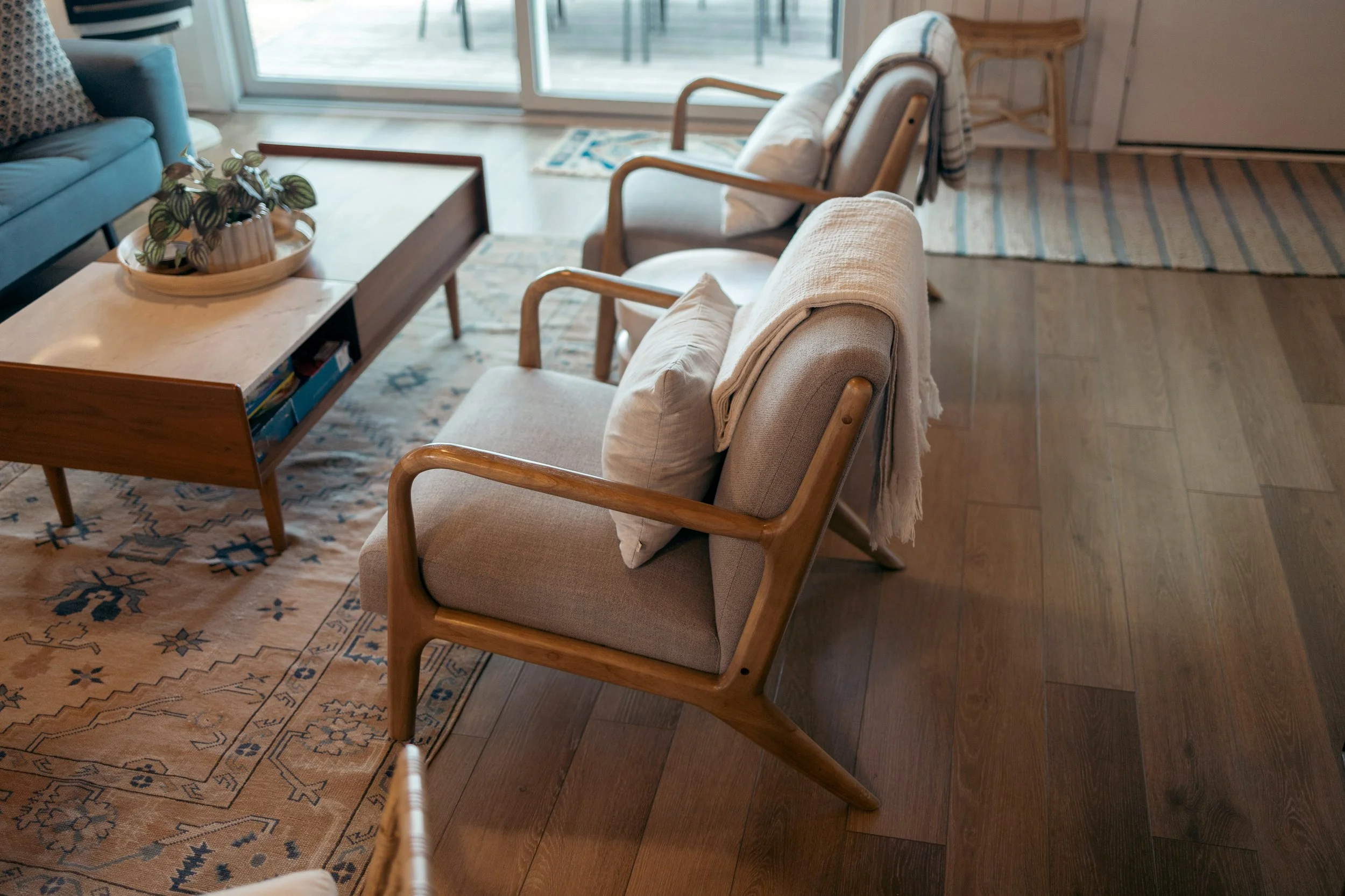 Cane-back chairs in a sunlit living room